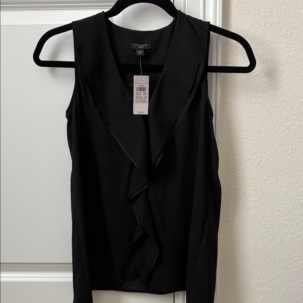 Ann Taylor Black Ruffle Front Blouse. New with tag. 100% polyester.